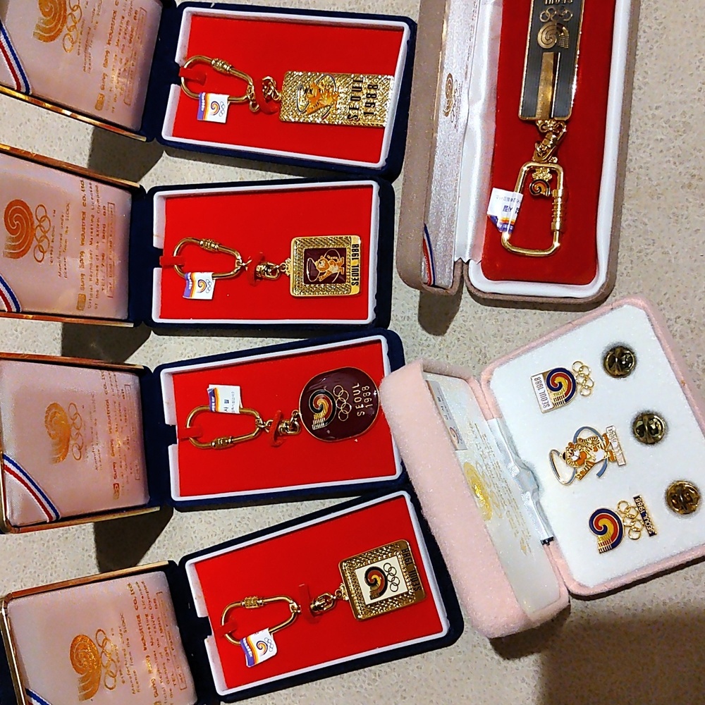 24 k gold plated, Vintage 1988 Olympic pins and keychains.